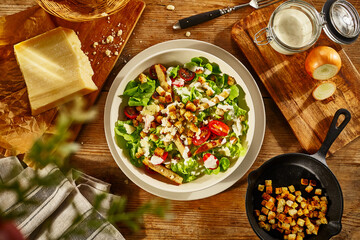 fresh salad with chicken on a wooden table