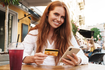 Close up of beautiful smiling red haired woman