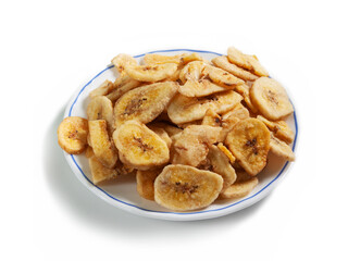 cut dried banana on a white saucer with a blue border isolated on a white background
