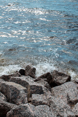 natural background waves and beach made of stones