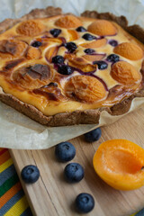 baking pie with apricots and blueberries close up