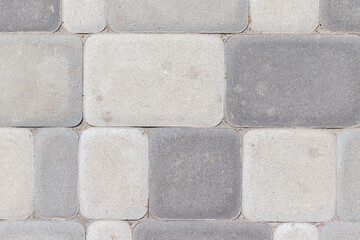 Outdoor concrete floor tiles background texture in different shades of gray