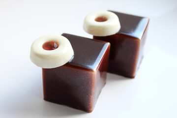 Two brandy jam and chocolate dessert with cream cheese isolated on white