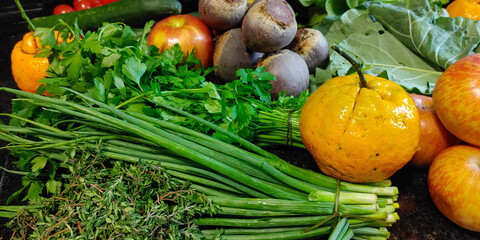 A small variety of fruits and vegetables that have just arrived from the organic fair.