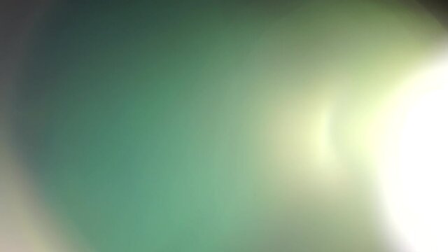 Real in camera lens flares or leaks. Light reflection of a glass crystal making colorful abstract prism figures.