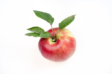Red apple with green leaves on a white background