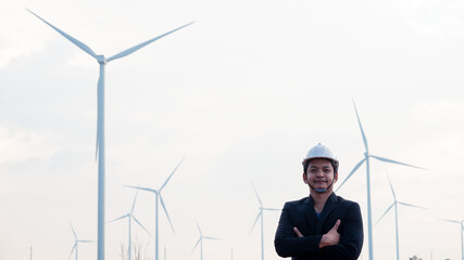 Smart engineer man standing with wind turbine.16:9 style