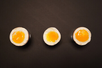3 eggs on the black background