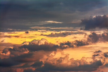 The clouds are beautifully illuminated by the setting sun.