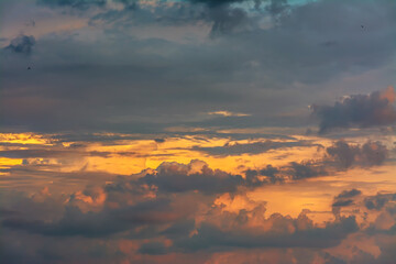 The clouds are beautifully illuminated by the setting sun.