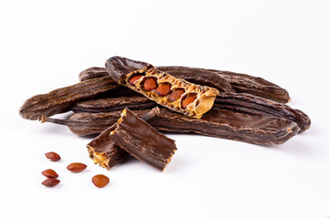 Dried carob on the white background