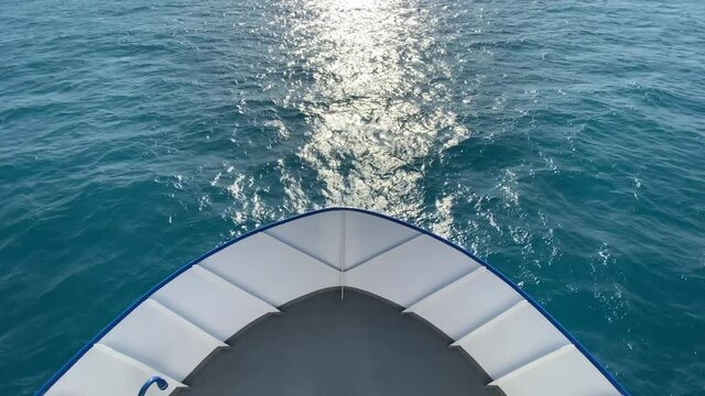 The ship sails at sea. View in front of the ship.