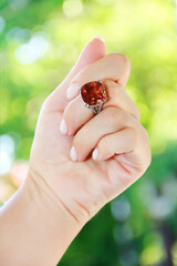 women's jewelry ring with a precious brown stone