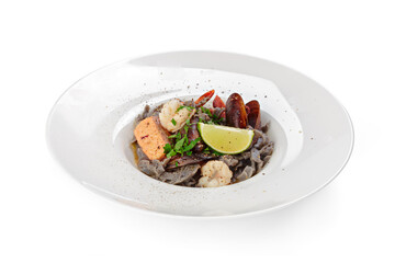 Seafood pasta in plate isolated on white