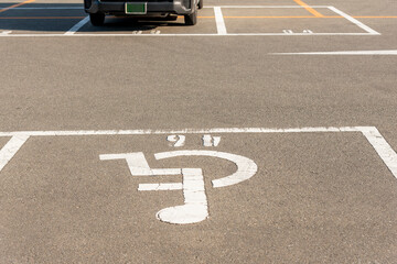 Handicapped symbol / icon on empty space Disabled Parking  reserved for disabled people