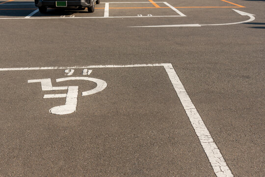 Handicapped symbol / icon on empty space Disabled Parking  reserved for disabled people