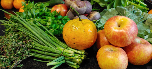 A small variety of fruits and vegetables that have just arrived from the organic fair.