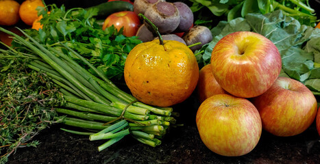 A small variety of fruits and vegetables that have just arrived from the organic fair.