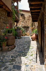 The narrow stone paved street of the old Kakopetria. Nicosia District. Cyprus