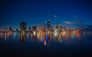 Fototapeta premium city skyline at night miami florida beautiful buildings reflection usa colors 