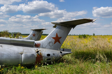 tail part- 8 August 2020: Old aircraft Antonov An-2 at abandoned Airbase aircraft cemetery in Vovchansk, Kharkov region, Ukraine.