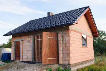Interior of a Unfinished Red Brick House Walls under Construction without Roofing
