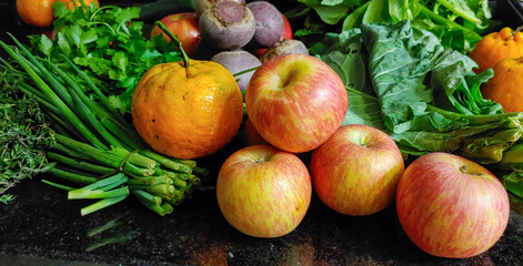 A small variety of fruits and vegetables that have just arrived from the organic fair.