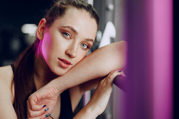 Portrait of a young sporty caucasian woman training in a fitness club