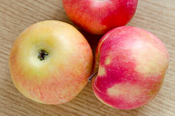 Red ripe apples on a light background in autumn, Sofia, Bulgaria   