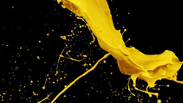 Yellow paint splash thrown in slow motion, liquid isolated on black (4K)