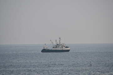 Fototapeta na wymiar Solitary ship on the sea