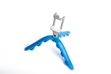 blue tripod tripod made of plastic and blue rubber on a white background.isolated image