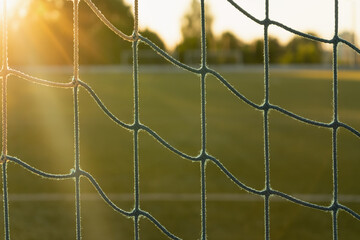 Netting on a football goal in the sunset light