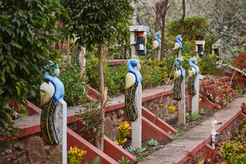 Fototapeta na wymiar Decorative Peacock at Rajiv Gandhi Park in Udaipur, India