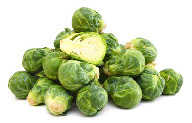 freshly brussel sprouts and some whole ones on a white background