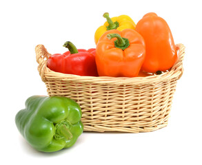 fresh pepper vegetables isolated in basket on white background