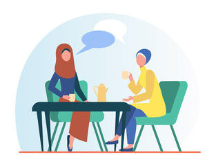 Muslim women meeting in Arabic coffee shop. Female friends wearing hijab drinking coffee flat vector illustration. Friendship, communication concept for banner, website design or landing web page