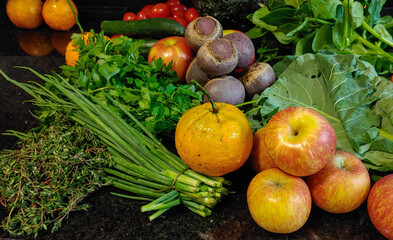 A small variety of fruits and vegetables that have just arrived from the organic fair.