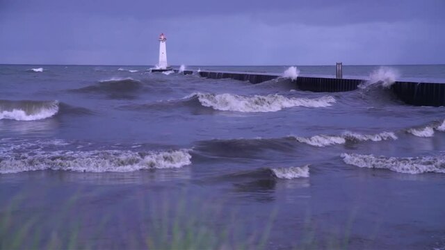 Clip of Sodus Bay Lighthouse in a summer storm on a windy morning. High quality 4k footage