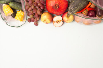 autumn vegetables and fruits in eco bags.