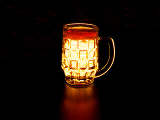 Light beer with foam on a dark background. Hop drink.