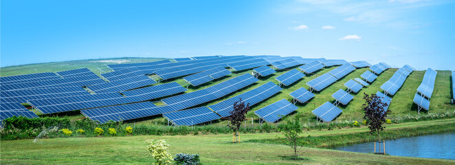 Blue solar panel background of photovoltaic modules for renewable energy. Copy space. Banner. Solar panels against blue sunny sky produce green, environmentally friendly energy from sun.