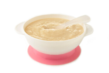 Baby porridge on plate isolated on white background