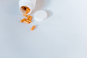 white plastic bottle with pills, vitamins, supplements, virus prevention