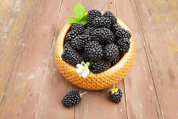 large ripe blackberries in a wicker basket