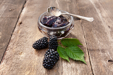 large ripe blackberries and blackberry jam
