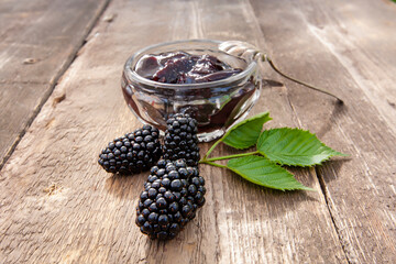 large ripe blackberries and blackberry jam
