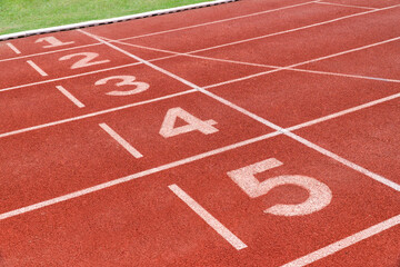 Running track with number in stadium. Close up start position in athlete track.