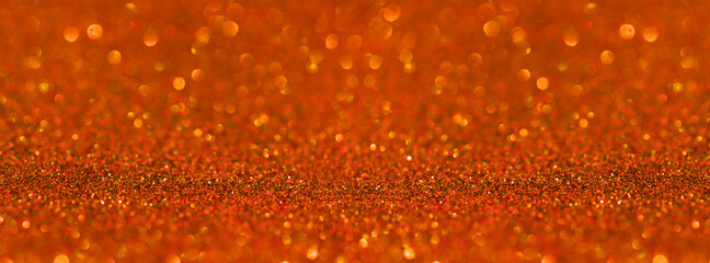 Banner orange saffron glitter bokeh background.