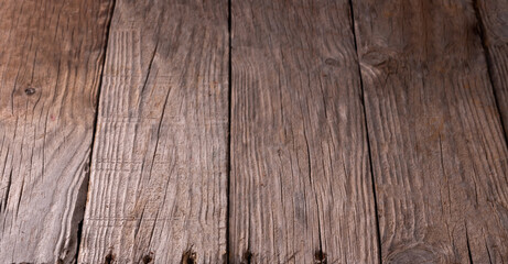 Old rustic wooden background with holes from the nails